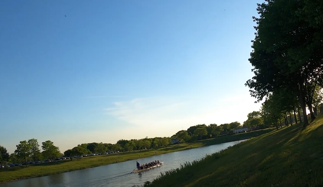 A boat on a lake in the sunset