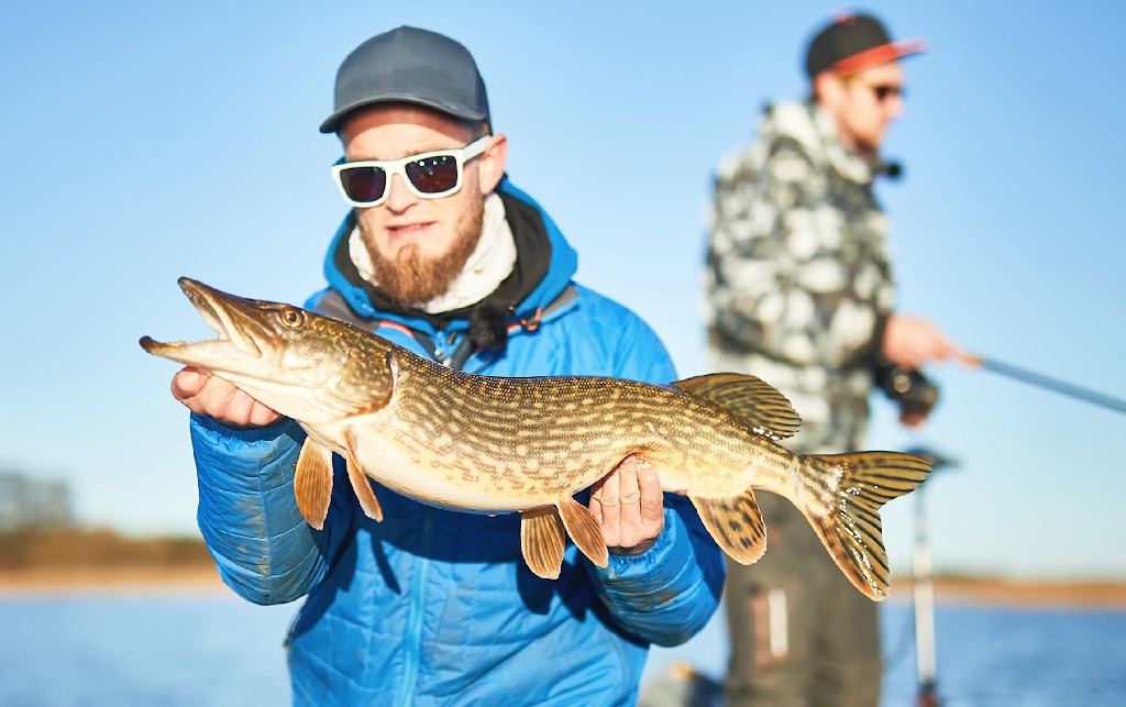 A man with his catch in hand